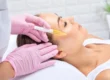 Woman getting Vampire Aesthetics Facial treatment | EC Medical Group