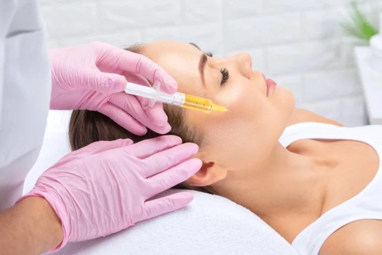 Woman getting Vampire Aesthetics Facial treatment | EC Medical Group